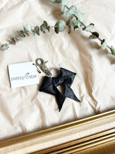 Load image into Gallery viewer, Black leather bows with keychain and lobster clip