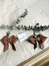 Load image into Gallery viewer, Medium brown soft leather bow keychain