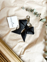 Load image into Gallery viewer, Black leather bows with keychain and lobster clip