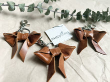 Load image into Gallery viewer, Light shine brown leather bow keychain