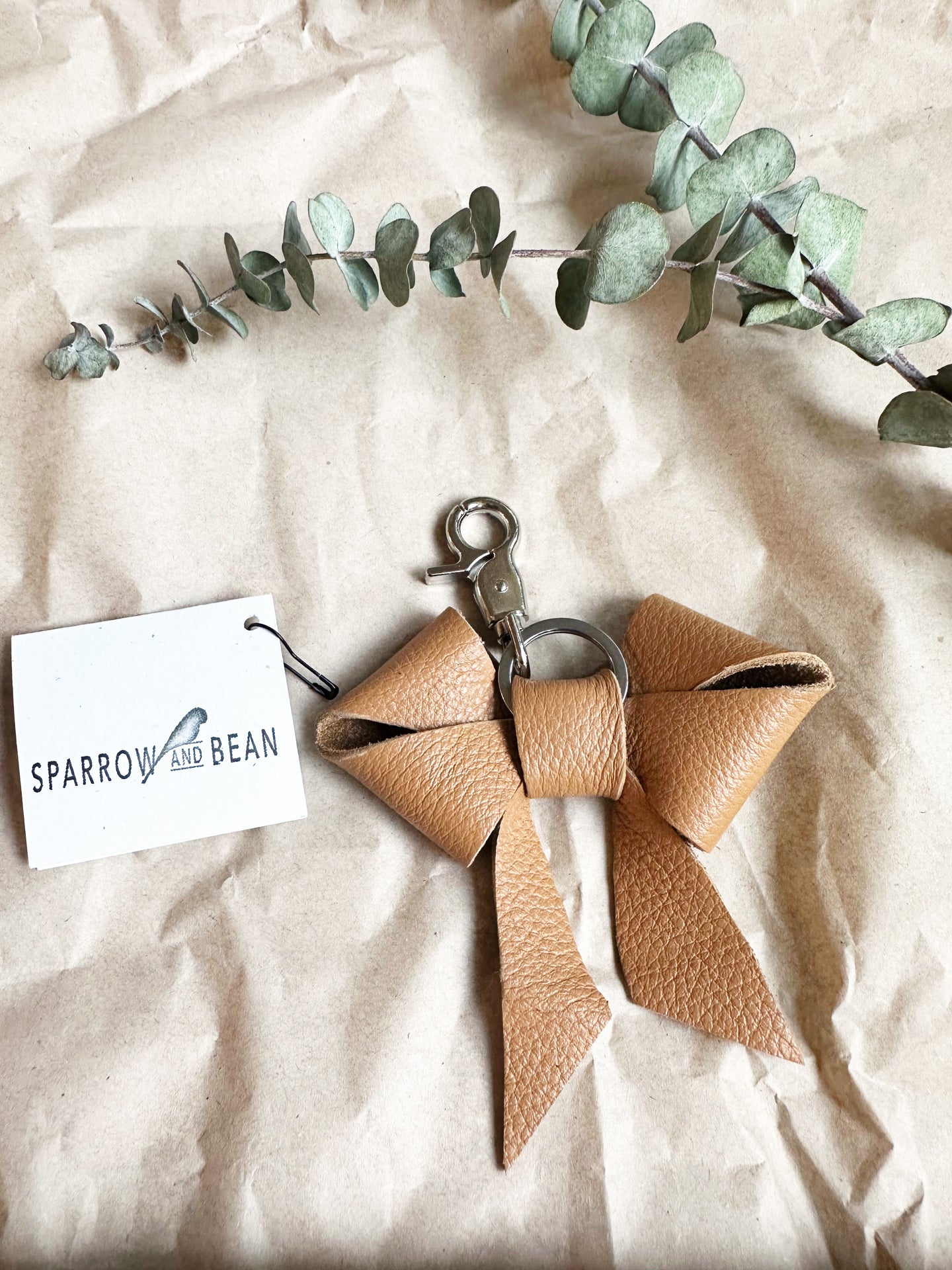 Tan leather bow keychain