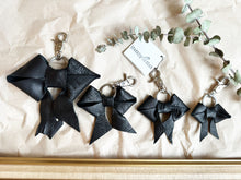 Load image into Gallery viewer, Black leather bows with keychain and lobster clip
