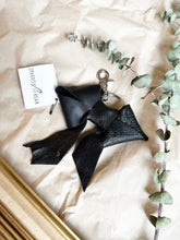 Load image into Gallery viewer, Black leather bows with keychain and lobster clip
