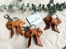 Load image into Gallery viewer, Redish brown leather bow keychain
