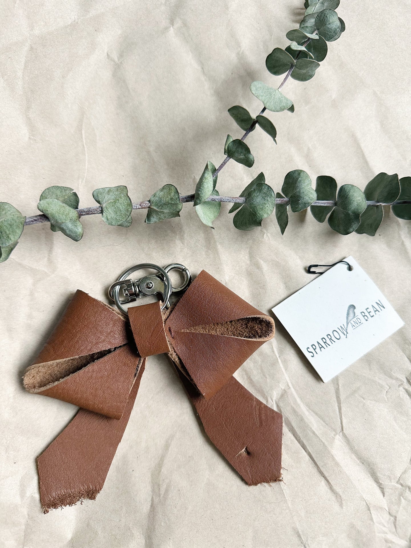 Medium brown soft leather bow keychain