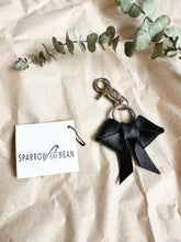 Load image into Gallery viewer, Black leather bows with keychain and lobster clip
