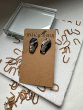 Load image into Gallery viewer, Coffin earrings black, white and granite w/ gold flakes &amp; resin top
